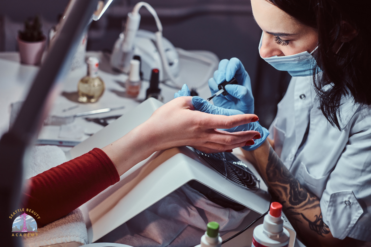 Manicure program students practicing nail techniques at Seattle Beauty Academy