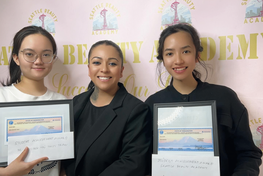 eauty instructor Yazmin Martinez celebrating with students at Seattle Beauty Academy