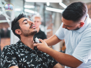 Barber shaping a clean beard neckline with a straight razor during a professional beard grooming service