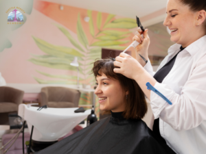Cosmetology student learning hair cutting and styling techniques in a professional beauty school setting