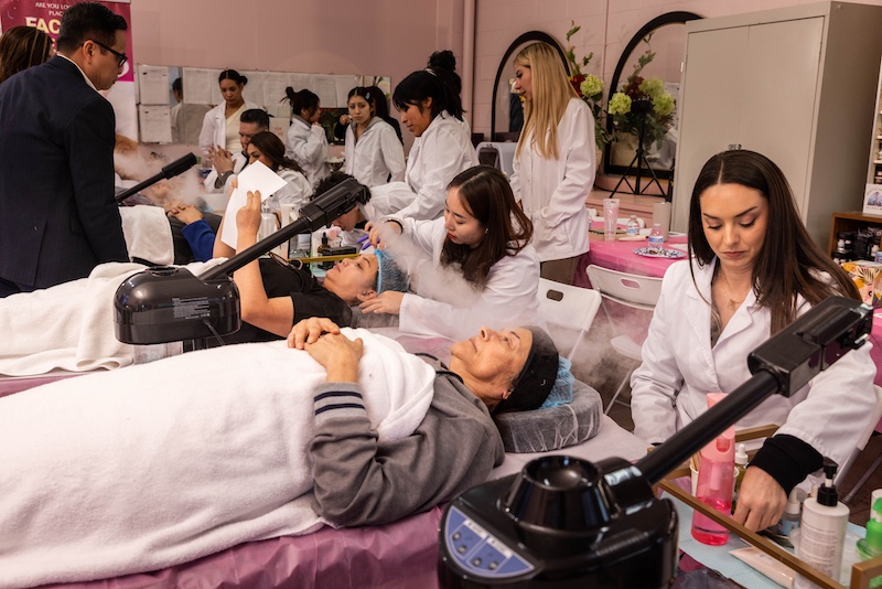 close up students practice facial cleaning at Esthetics class