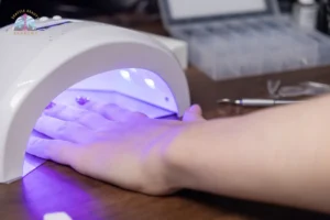 a client is applying gel product that cures under UV:LED light in Seattle, Washington