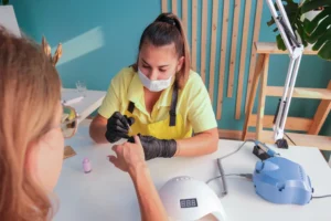 nail master making nails manicure to the client in a nail salon in Seattle Washington