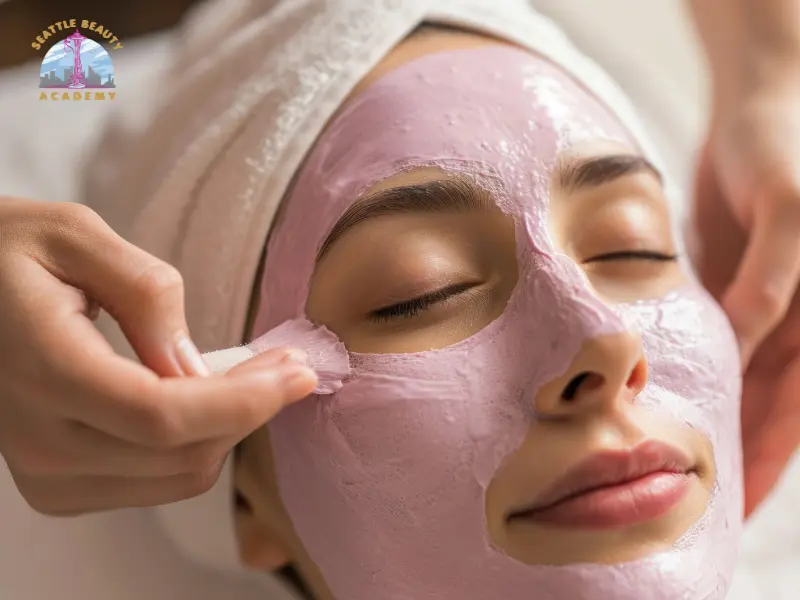 Esthetician applying a facial mask treatment — a core skincare service taught in Washington esthetician courses