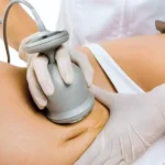 Hands-on body contouring certification training in Seattle — student practicing wrap technique at Seattle Beauty Academy