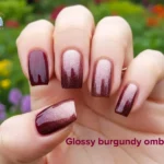 Fall Nail Trends 2026 - Burgundy ombre nails manicured hand with gradient nails