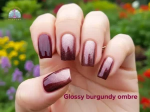 Fall Nail Trends 2026 - Burgundy ombre nails manicured hand with gradient nails