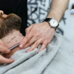 Professional neckline shaving technique demonstrated during a beard grooming techniques course in Seattle