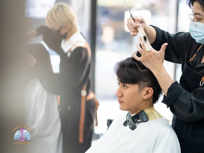 Beauty school student practicing hairstyling techniques during hands-on training