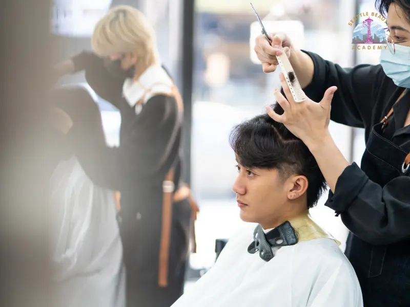 Beauty school student practicing hairstyling techniques during hands-on training