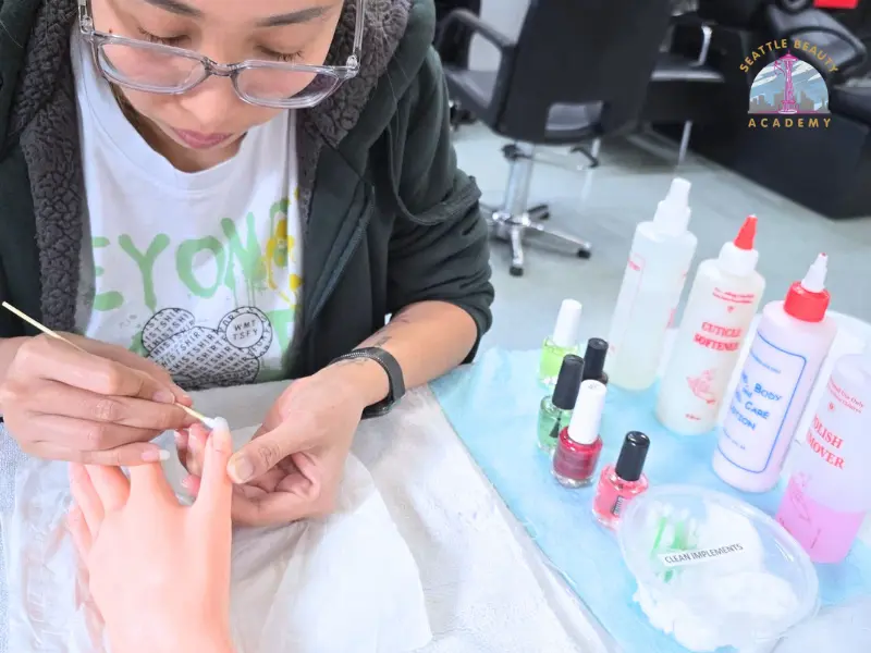 Washington nail technician student practicing nail techniques