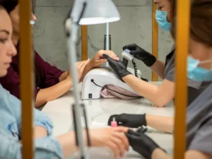 a nail tech working in a nail salon after moving to Washington