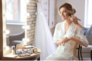 Bridal makeup application using beauty brushes and a makeup sponge