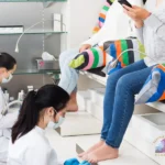 Licensed nail technician performing a professional pedicure at salon in Washington