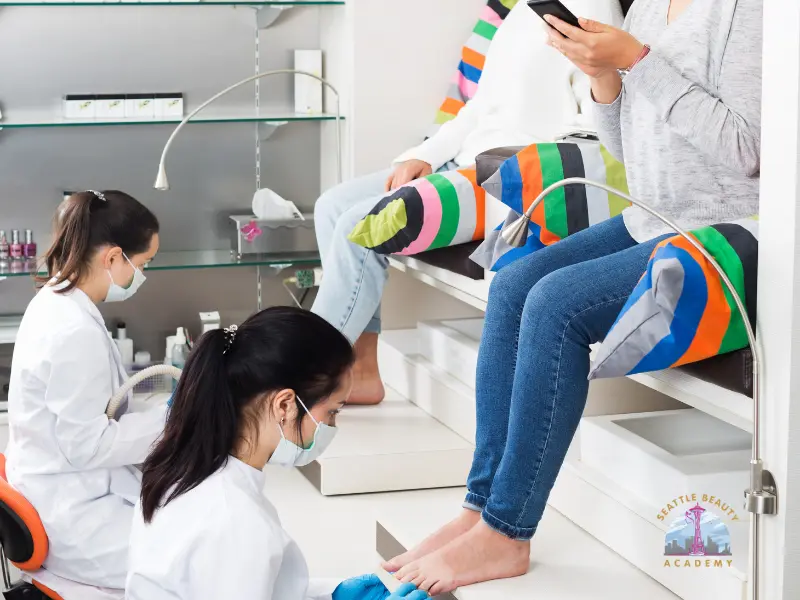 Licensed nail technician performing a professional pedicure at salon in Washington